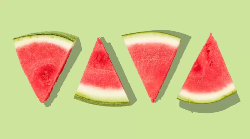 sliced watermelon with green background